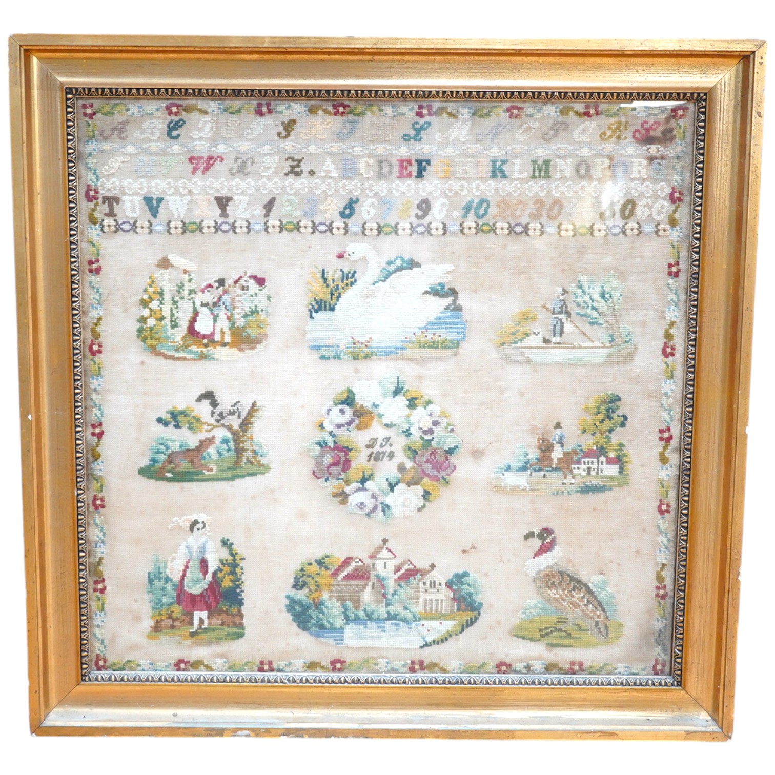 A framed sampler, initialled and dated 1874, worked with nine detailed pictorial motifs below a band of alphabet letters and numerals, each pictorial motif a different scene, a soldier and his wife, a white swan, a sailo